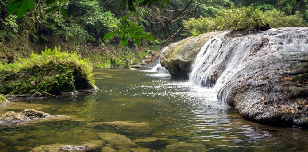 Pristine natural pool at Whisper Wave Waterfall